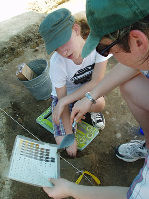 Summer Campers learn how to describe soil layers. Courtesy, Alexandria Archaeology.