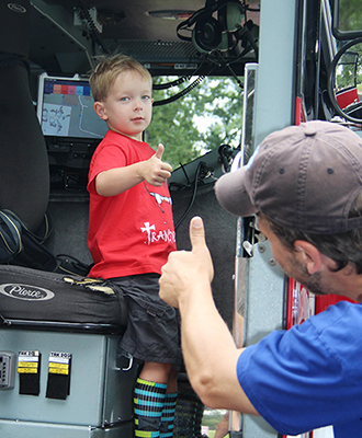 Alexandrians enjoy exploring City vehicles at Tons of Trucks.